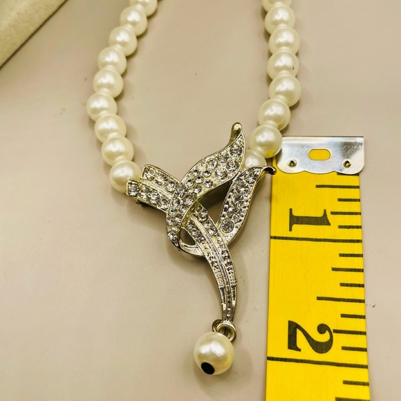 Faux pearl necklace with rhinestone pendant and a pearl tassel. 20 inches long. - Picture 5 of 6